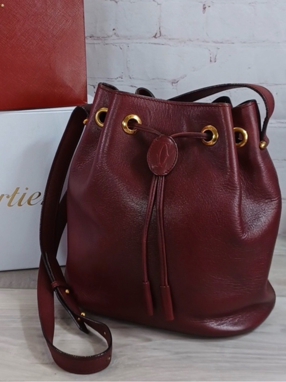 CARTIER PRISTINE Calfskin Ox Blood Red Leather Drawstring Bucket Bag NWOT